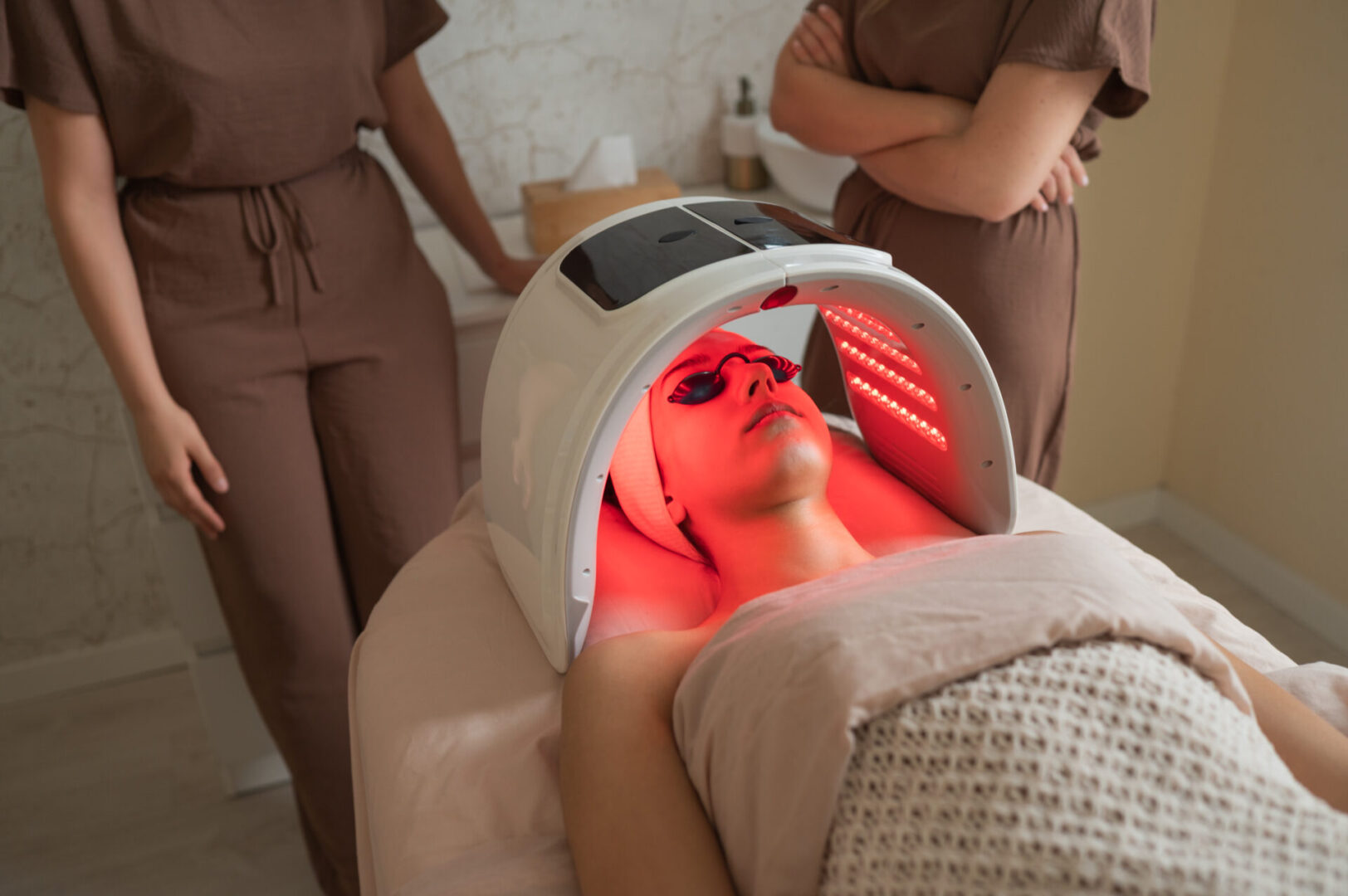 A patient receiving red light therapy for advanced skin rejuvenation and healing.